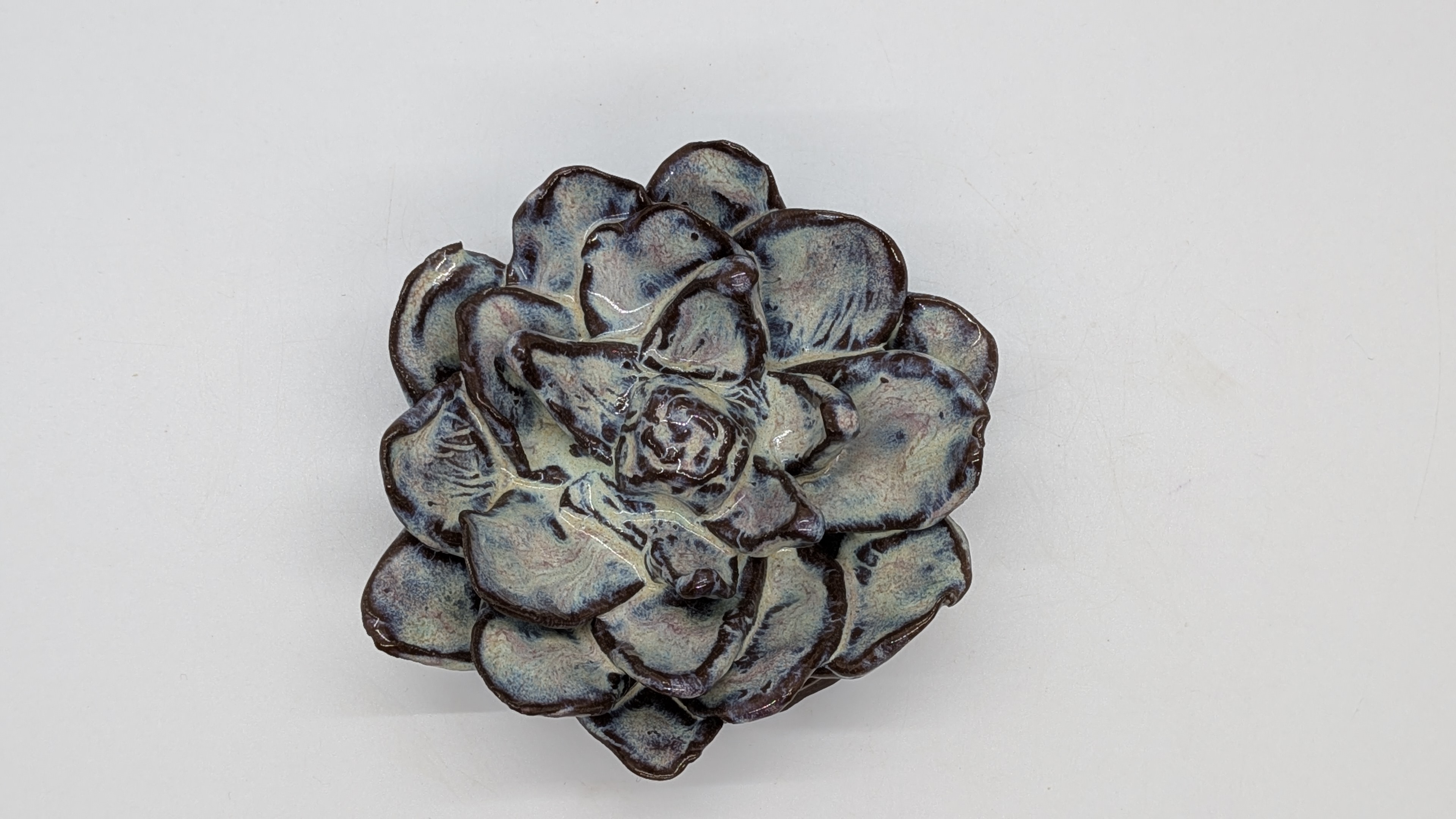 White Wall Flower - A hand-built flower to hang on your wall. Features an opening in the back to allow you to simply hang it on a nail. - 15.00